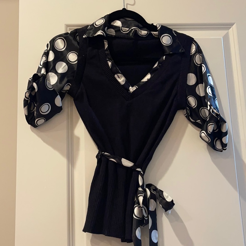 Women’s blouse with black sweater vest